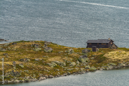 The small wooden house at the lake Ustevatn. Hordaland, Norway photo