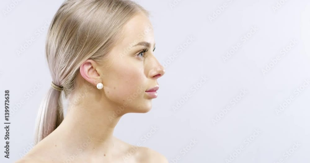 Studio beauty portrait of woman with long blonde hair Studio beauty portrait of woman with long blonde hair