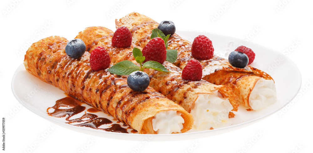 Rolled pancakes on a plate. Rolled pancakes on a plate.