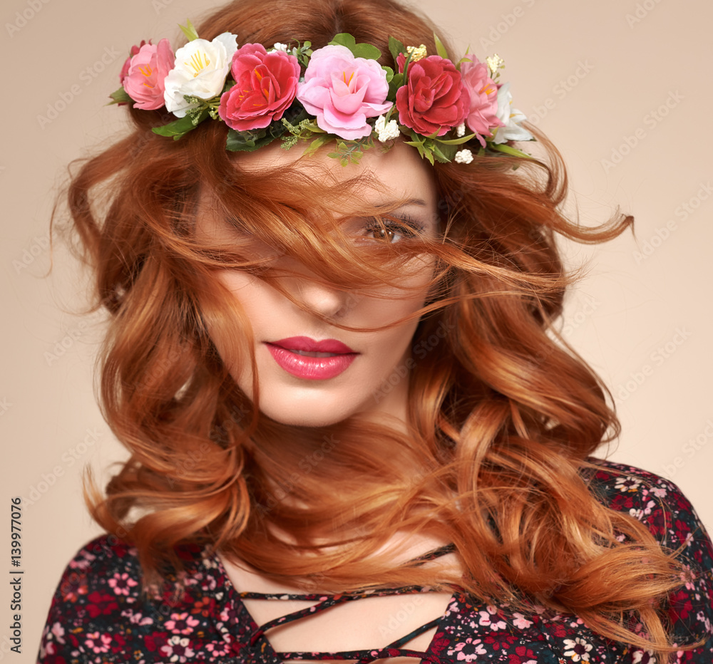 Fashion Beautiful Curly Redhead Portrait in Flower Wreath. Shiny Curly flower fashion Volume Hairstyle. Happy Beauty Model Woman. Glamour Confident Sexy lady, fashion Makeup, Boho wreath, Trendy Dress
