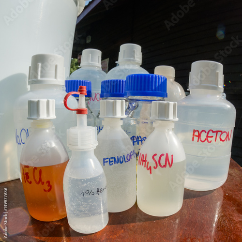 various reagents in bottles (liquids) - open air laboratory