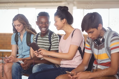 Students using mobile phone in campus