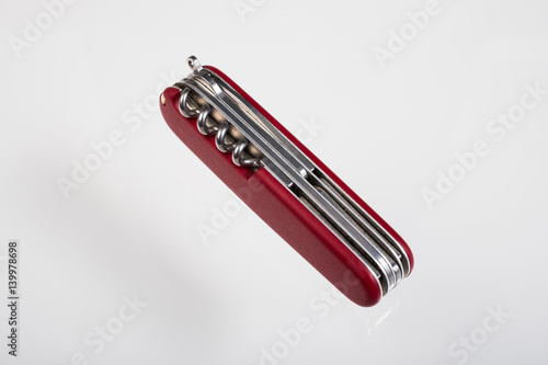 Red multitool closed knife isolated