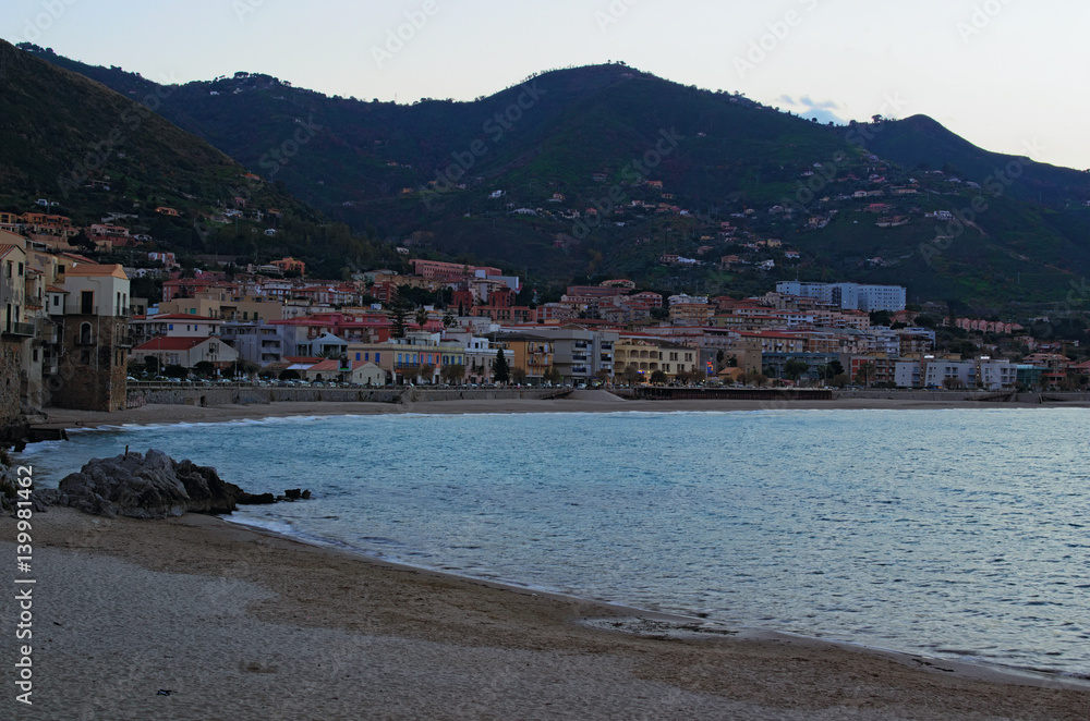 A small town on the shore of the sea. Cefalu is located between sea and mountains. Cefalu. Sicily. Italy