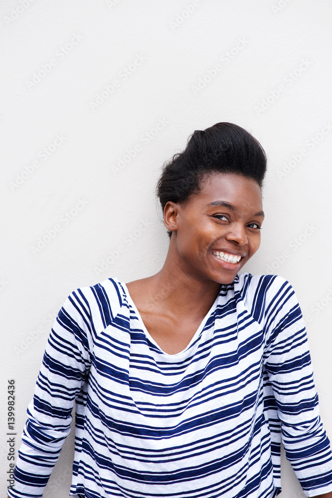 smiling african american woman against white background smiling african american woman against white background