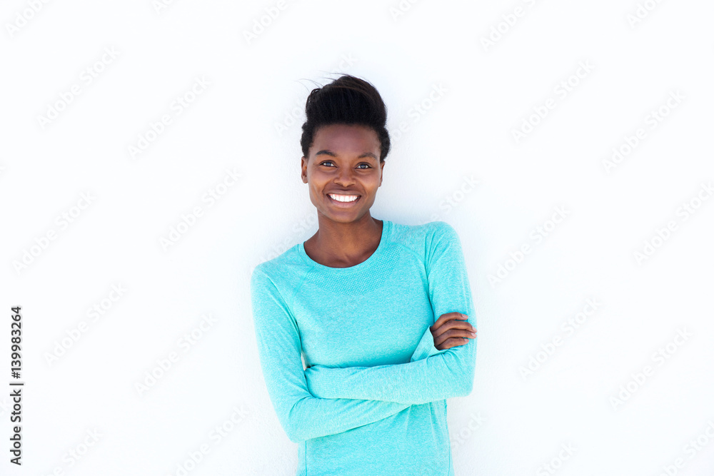 smiling young woman against white wall smiling young woman against white wall