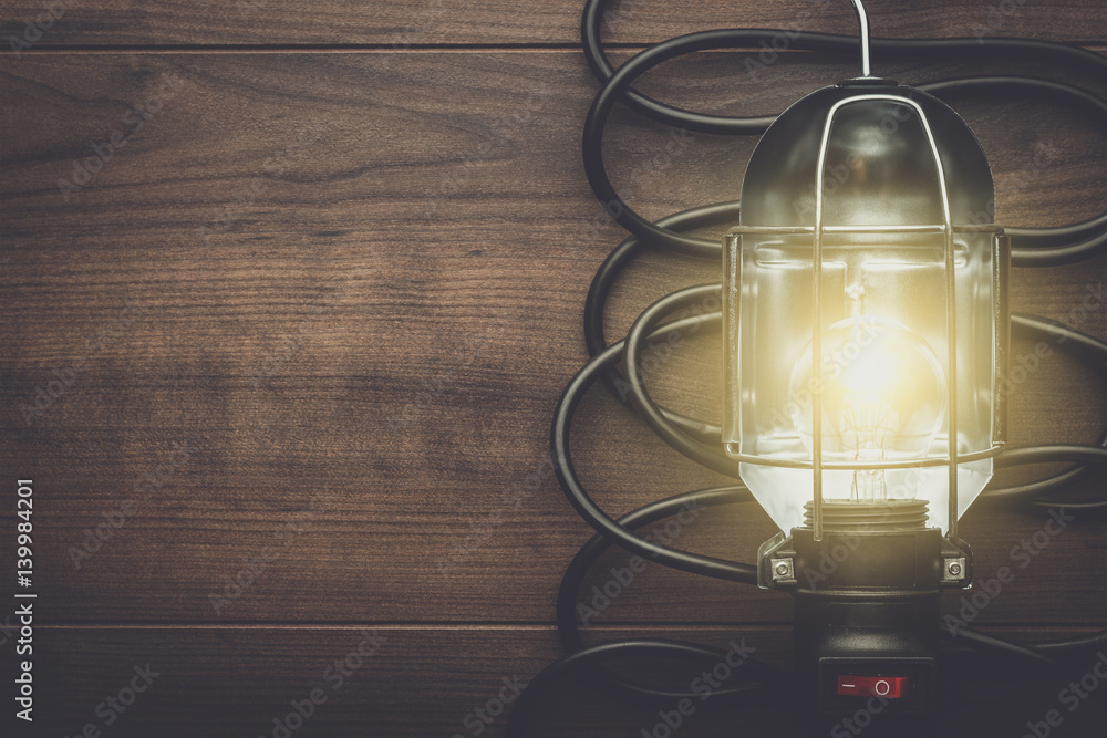 hand lamp on the brown wooden background