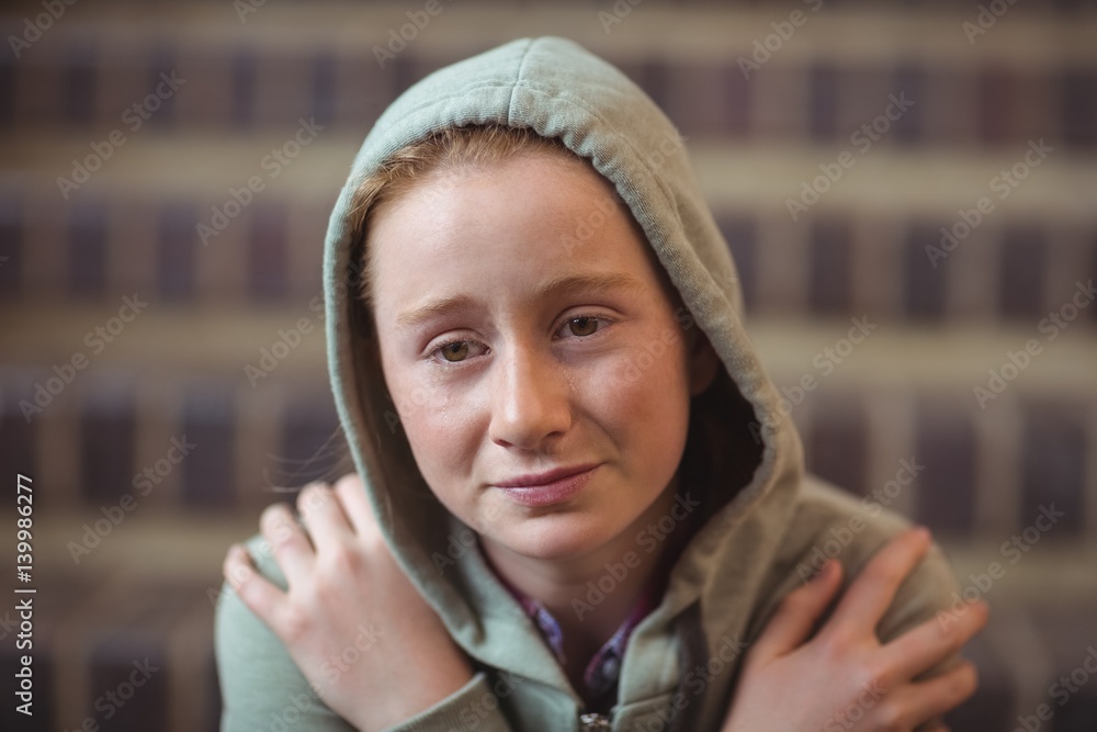 Sad schoolgirl sitting alone on staircase Sad schoolgirl sitting alone on staircase