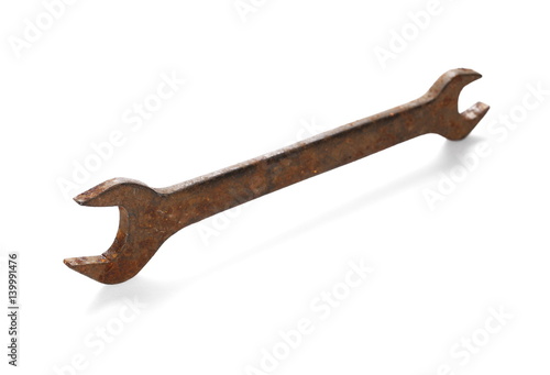 old rusty wrench isolated on white