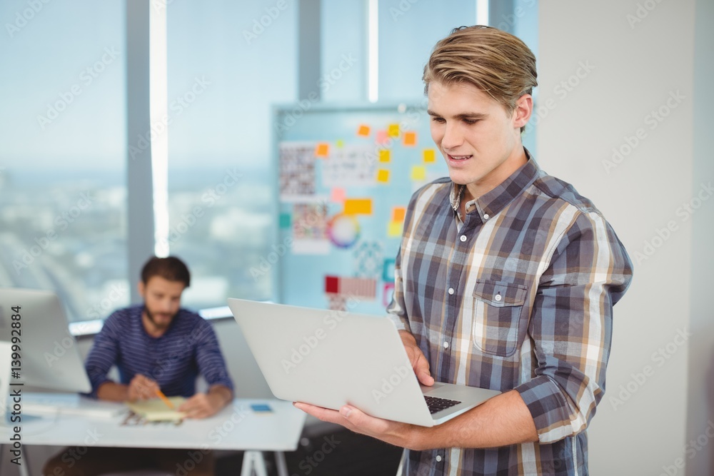Male executive using laptop Male executive using laptop
