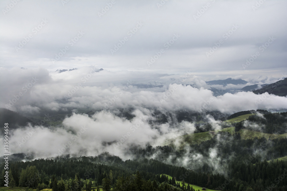 Fototapeta premium Misty landscape on Kitzbuhel mountain, Tirol, Austria