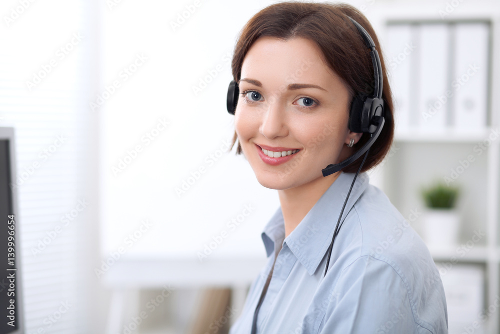 Young beautiful business woman in headset. Call center. Young beautiful business woman in headset. Call center.