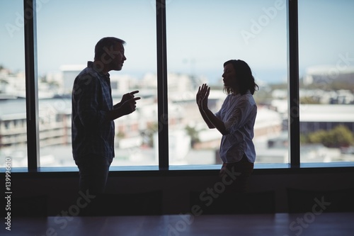 Tableau sur toile Couple arguing near the window