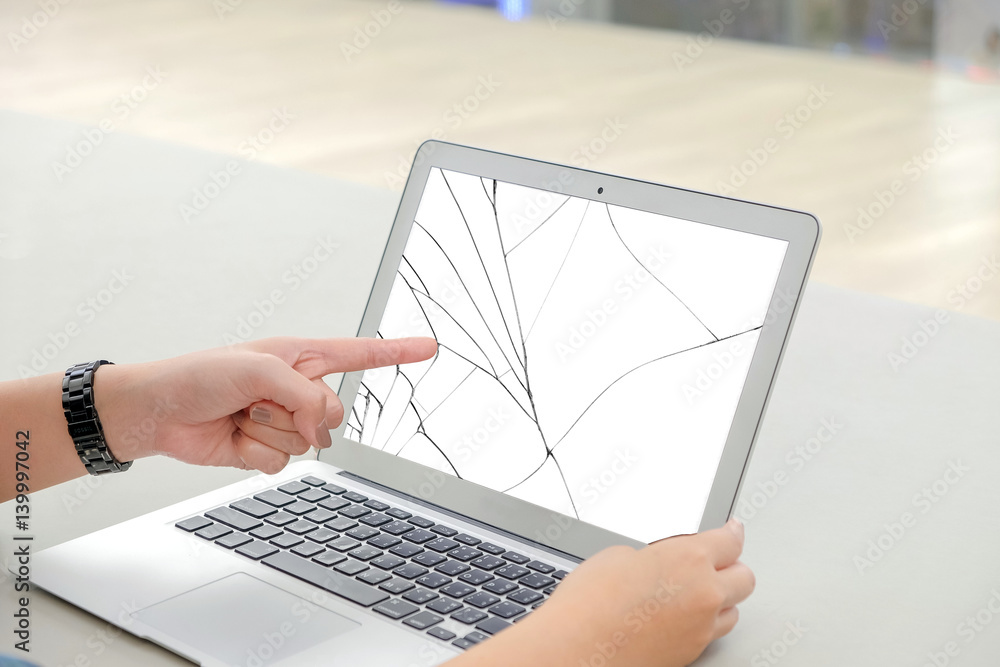 Left finger of woman, she pointing at the white screen laptop, the ...