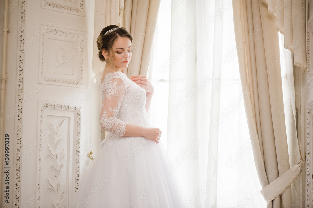 Beautiful bride in wedding dress before wedding ceremony Beautiful bride in wedding dress before wedding ceremony