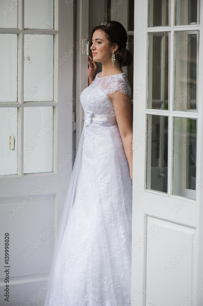 Beautiful bride in wedding dress before wedding ceremony Beautiful bride in wedding dress before wedding ceremony