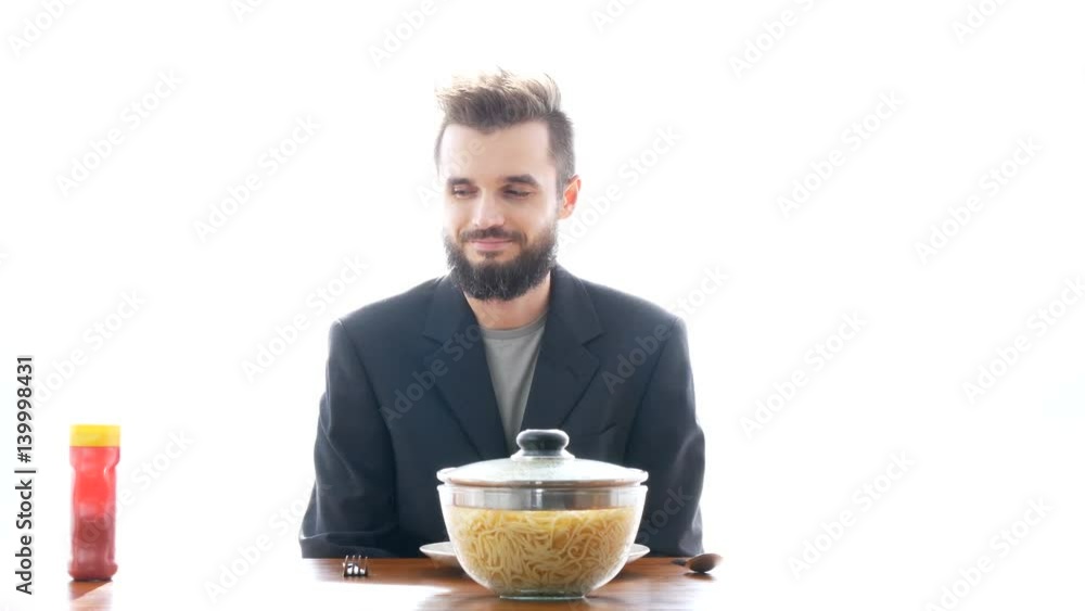 Delighted bearded man with bowl of hot pasta, studio isolated on white background. Delighted bearded man with bowl of hot pasta, studio isolated on white background.