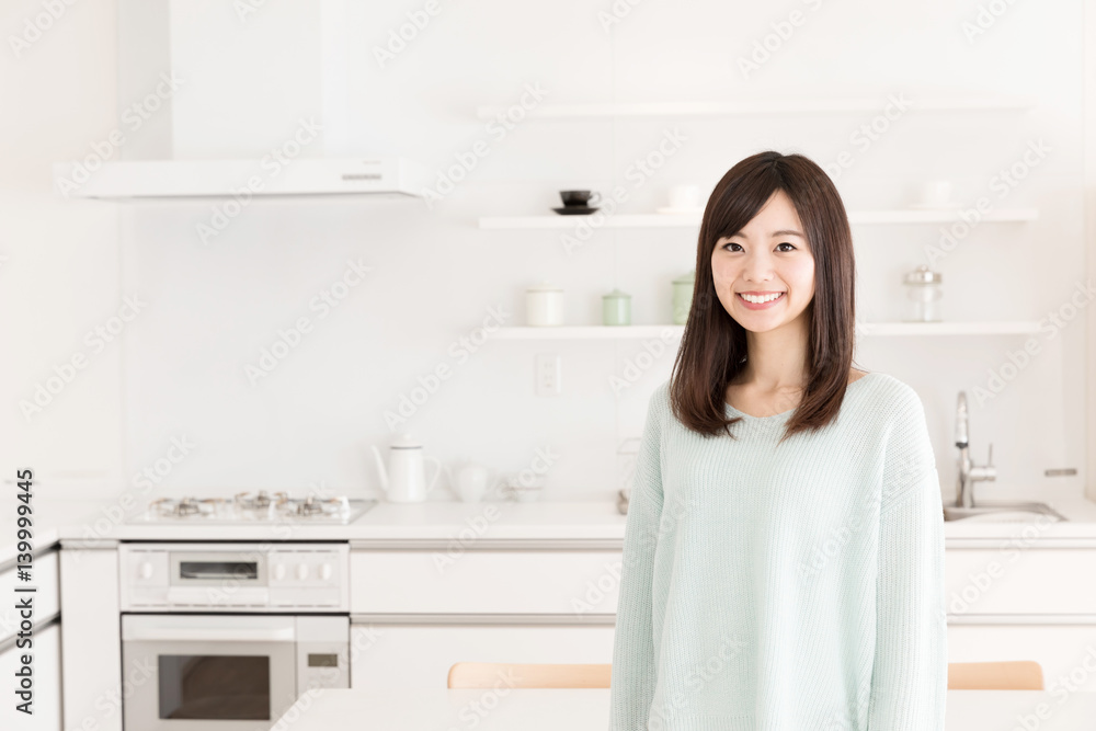 portrait of young asian woman in the kitchen portrait of young asian woman in the kitchen