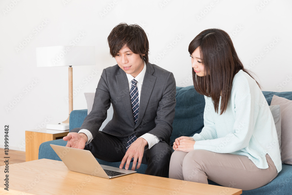 asian businessman talking in living room