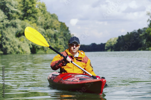 A trip by the river on a kayak.