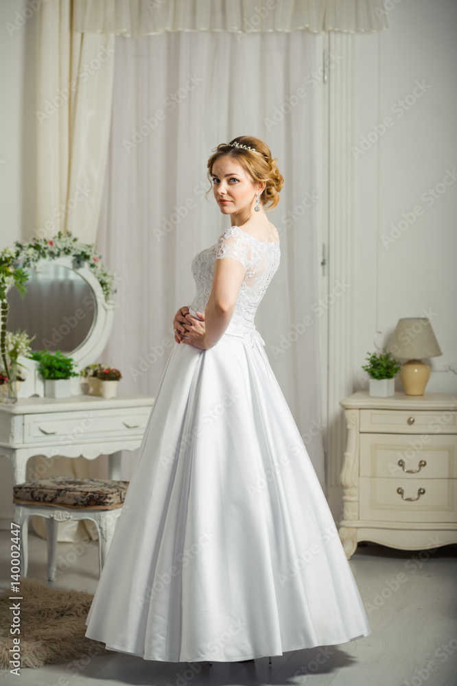 Beautiful bride before wedding ceremony in appartament Beautiful bride before wedding ceremony in appartament