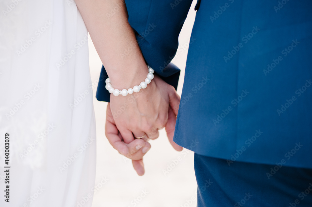 Newlyweds staying arm in arm