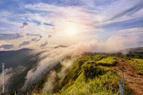 Fotografie Beautiful landscape nature on peak mountain with sun cloud fog and bright colors