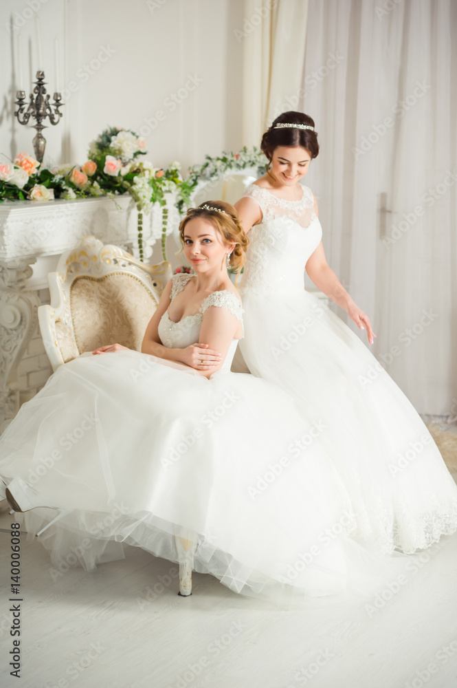 Two beautiful brides in wedding dress