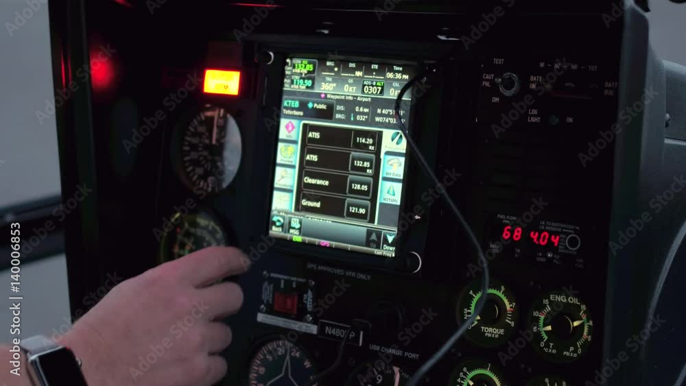CLOSE UP: A helicopter pilot manipulates the helicopter flight controls to achieve and maintain controlled aerodynamic flight. Pilot adjusting the settings to take off in a chopper and start a journey CLOSE UP: A helicopter pilot manipulates the helicopter flight controls to achieve and maintain controlled aerodynamic flight. Pilot adjusting the settings to take off in a chopper and start a journey