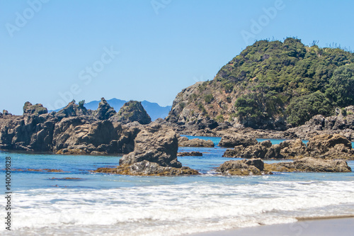 coastline with sand beach and rocks  sea background  new zealand nature