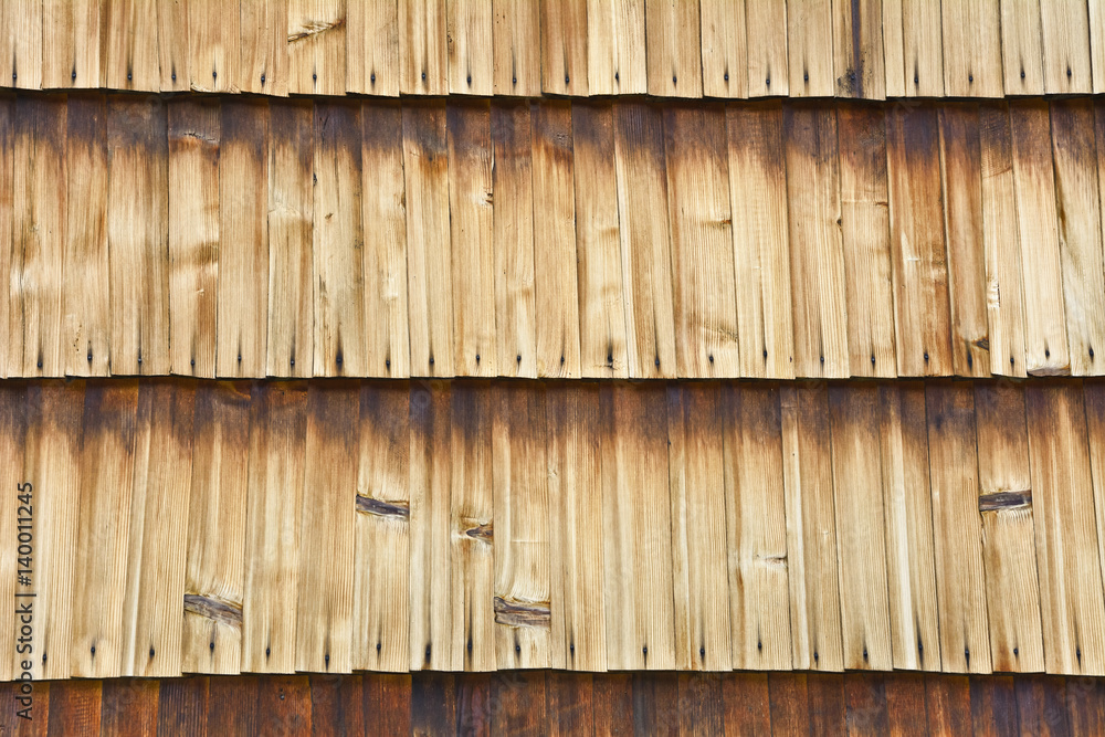 Wall of the building shingle with boards.
Wooden lining of a building wall with stains. Wall of the building shingle with boards.
Wooden lining of a building wall with stains.