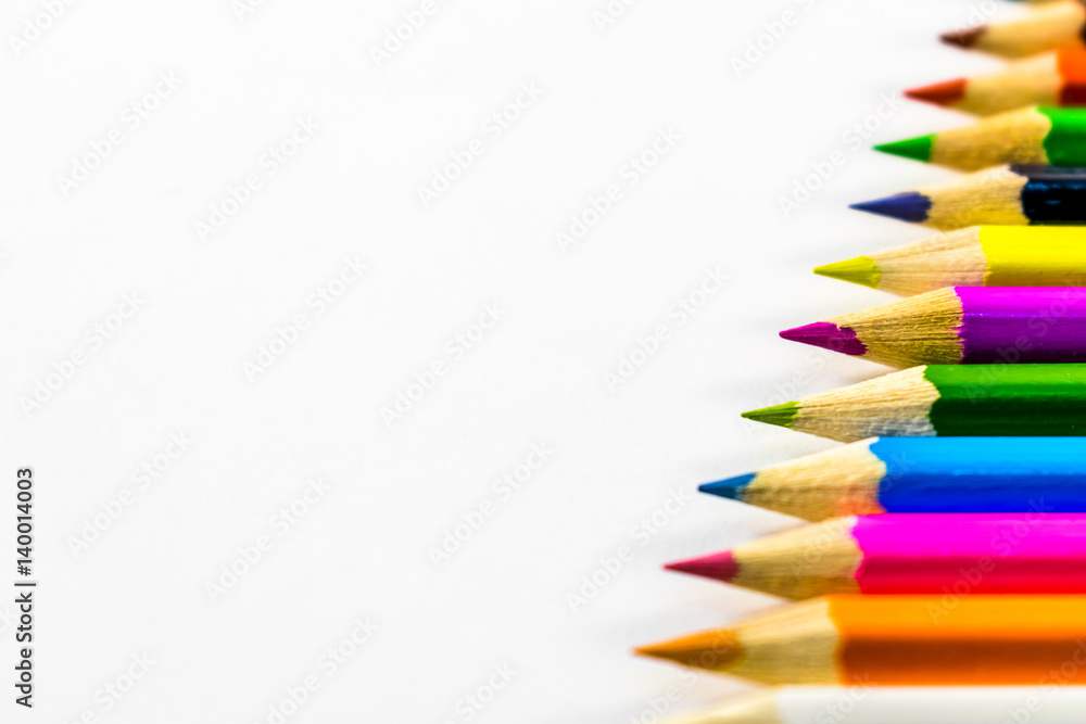 School supplies colored pencils in a row School supplies colored pencils in a row