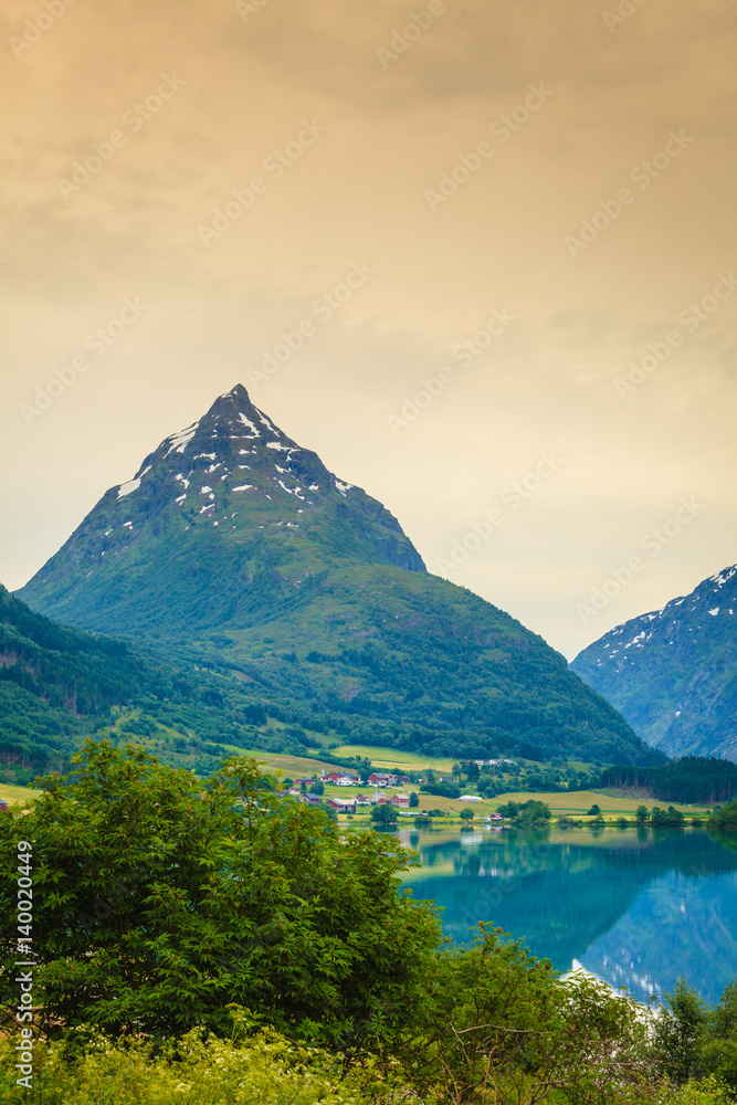 Reflection of mountains in norwegian fjord lake