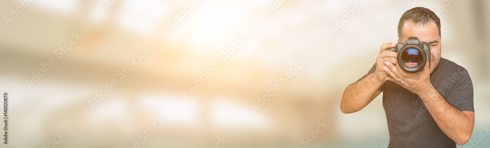 Hispanic Man with DSLR Camera Wide Banner with Room For Copy. Hispanic Man with DSLR Camera Wide Banner with Room For Copy.