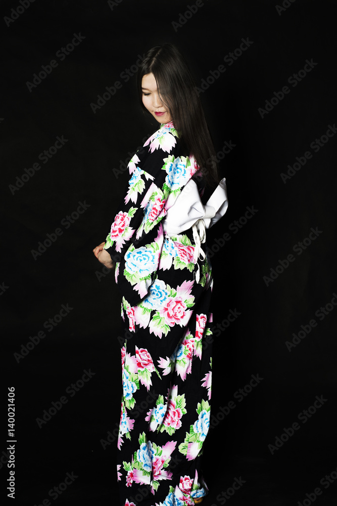 Japanese girl in traditional Japanese kimono on black background. Japanese girl in traditional Japanese kimono on black background.
