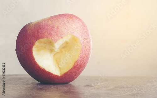 Foto Red apple with heart bite,Love concept