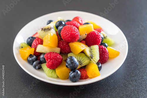 mixed fresh fruits  strawberry  raspberry  blueberry  kiwi  mango 