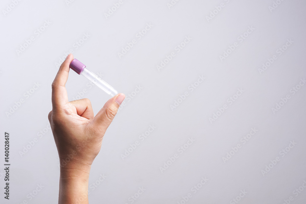 Hand holding empty test tube Hand holding empty test tube
