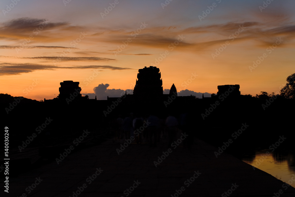 Angkor Wat Temple Entrance at Morning Sunrise with Tourists in Cambodia