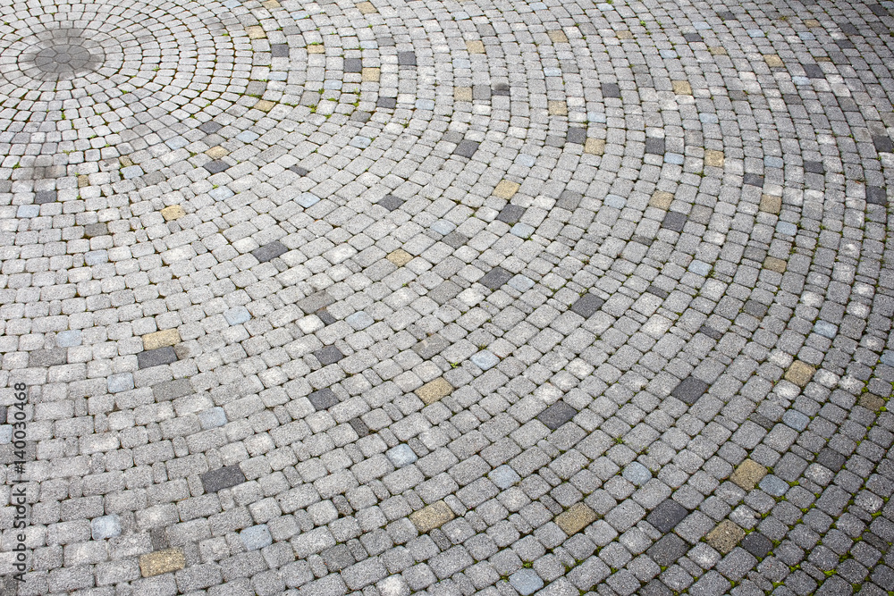 Fototapeta premium Fragment of stone surface, radial pattern of masonry, circular space