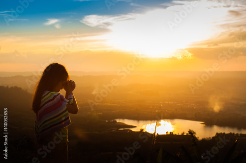 Girl praying on the Mount, thank God.