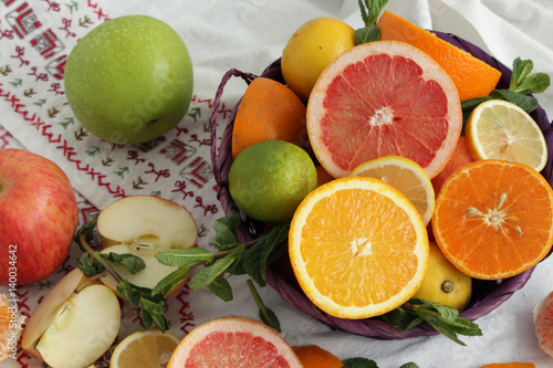 Fruit basket.sliced citrus fruits on a brown table  mixed color