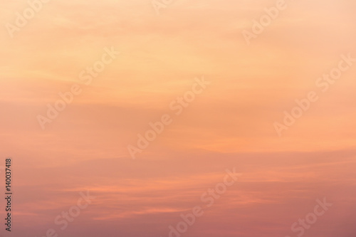 Colorful dramatic sky with cloud at sunset.Sky with sun background. © kaiskynet