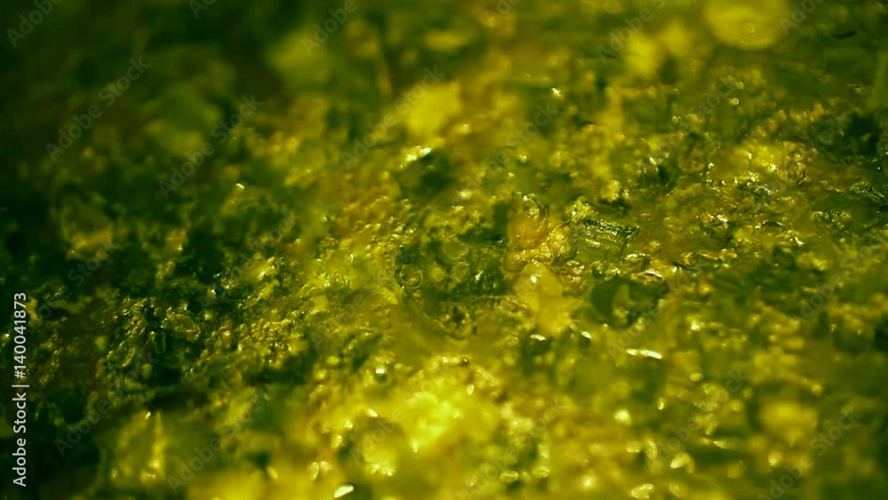 Mixing freshly prepared soup of meat, with rice, potatoes and green onions. Top view close-up. Mixing freshly prepared soup of meat, with rice, potatoes and green onions. Top view close-up.