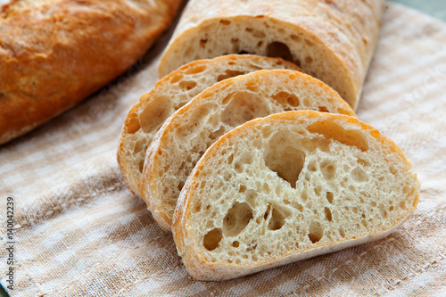 Fresh sliced italian Ciabatta bread on background