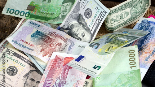 US dollars, Korean Won, Euro bills and some money bills and banknotes. Currency foreign exchange. Business and Financial or money management for investments.