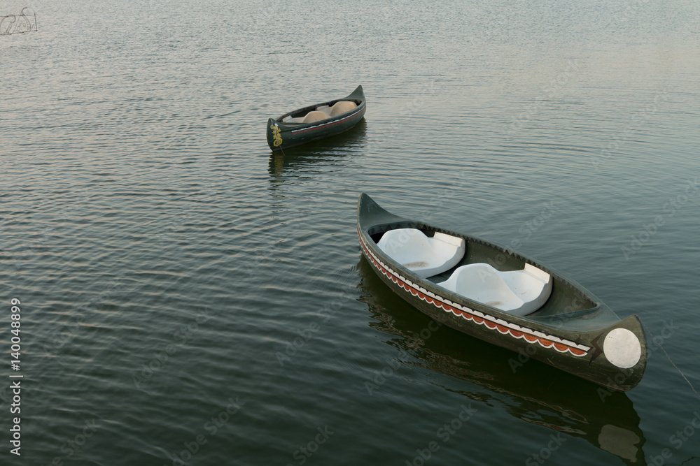 old canoes float on lake,Thailand