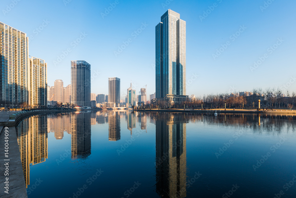 River And Modern Buildings Against Sky in Tianjin,China.