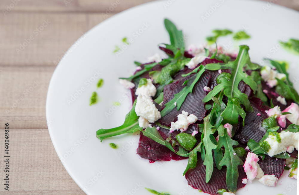 Salad with beet, feta, arugula and pesto Salad with beet, feta, arugula and pesto