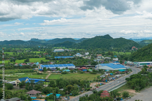 Thailand landscape of rural city and mountain under the cloudy sky © aimsaranporn